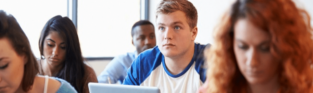 Stock image of students in college classroom
