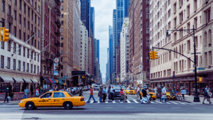 new york city street view with pedestrians and cars